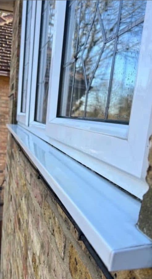 Clean white window frame and sill after professional washing